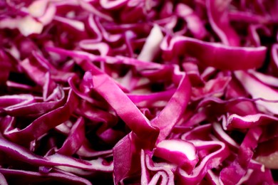 Photo of Tasty fresh shredded red cabbage as background, closeup