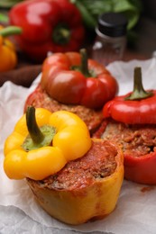 Photo of Delicious stuffed bell peppers served on table, closeup