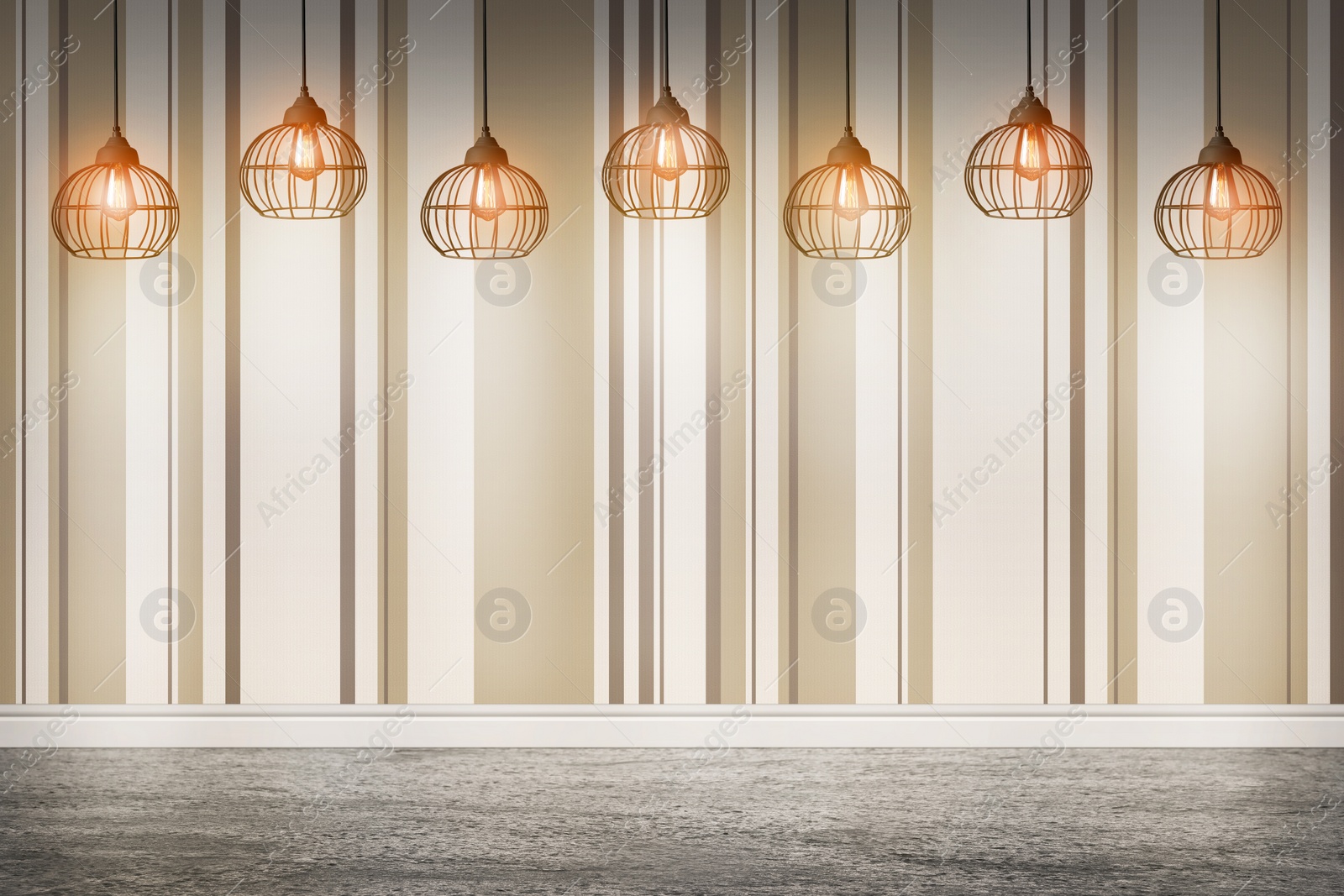 Image of Striped wallpaper and glowing hanging lamps in room