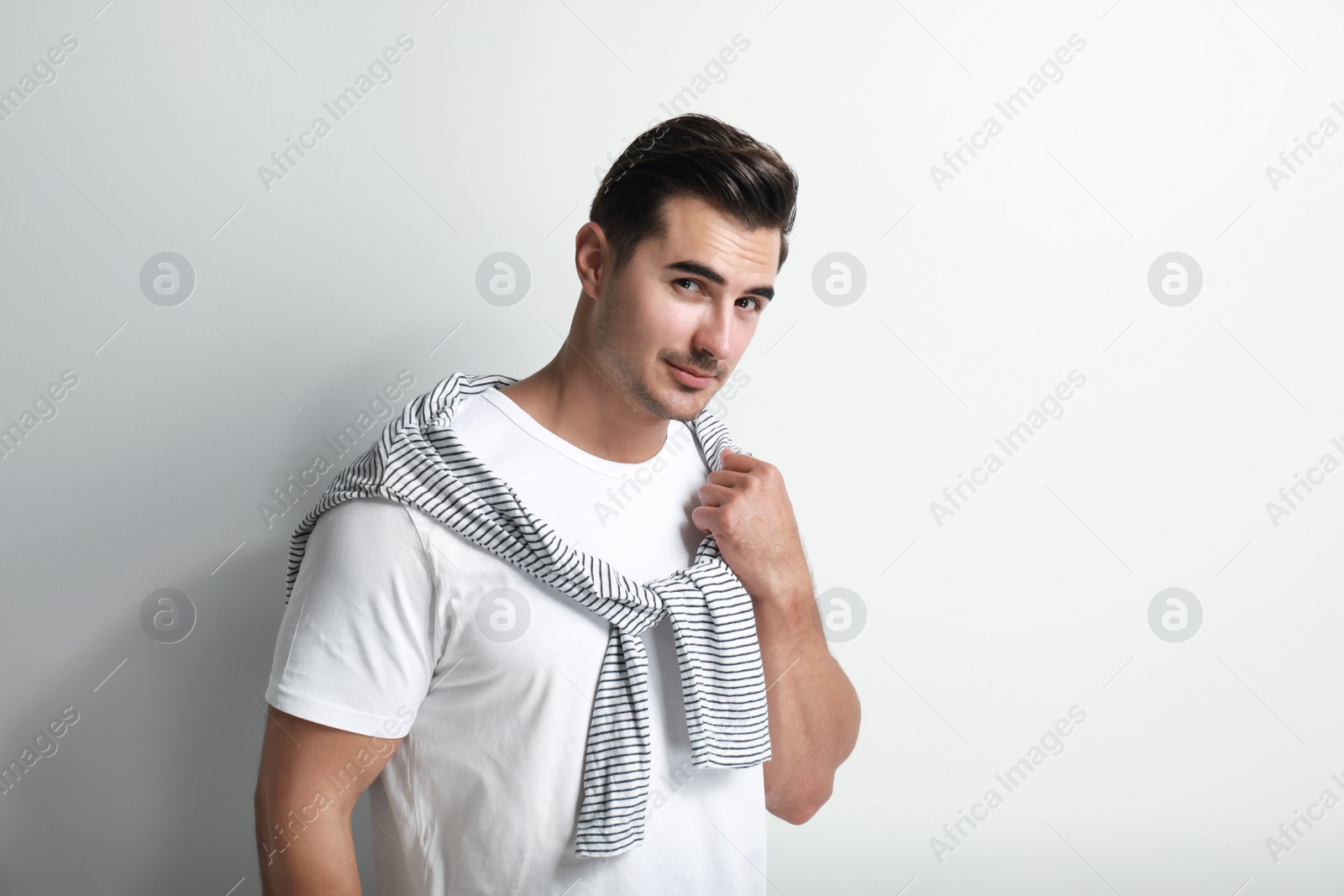 Photo of Portrait of handsome young man on white background