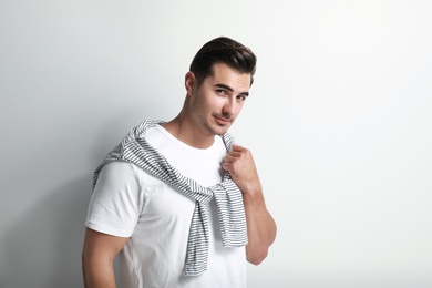 Portrait of handsome young man on white background