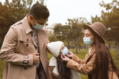 Lovely family spending time together in park during coronavirus pandemic