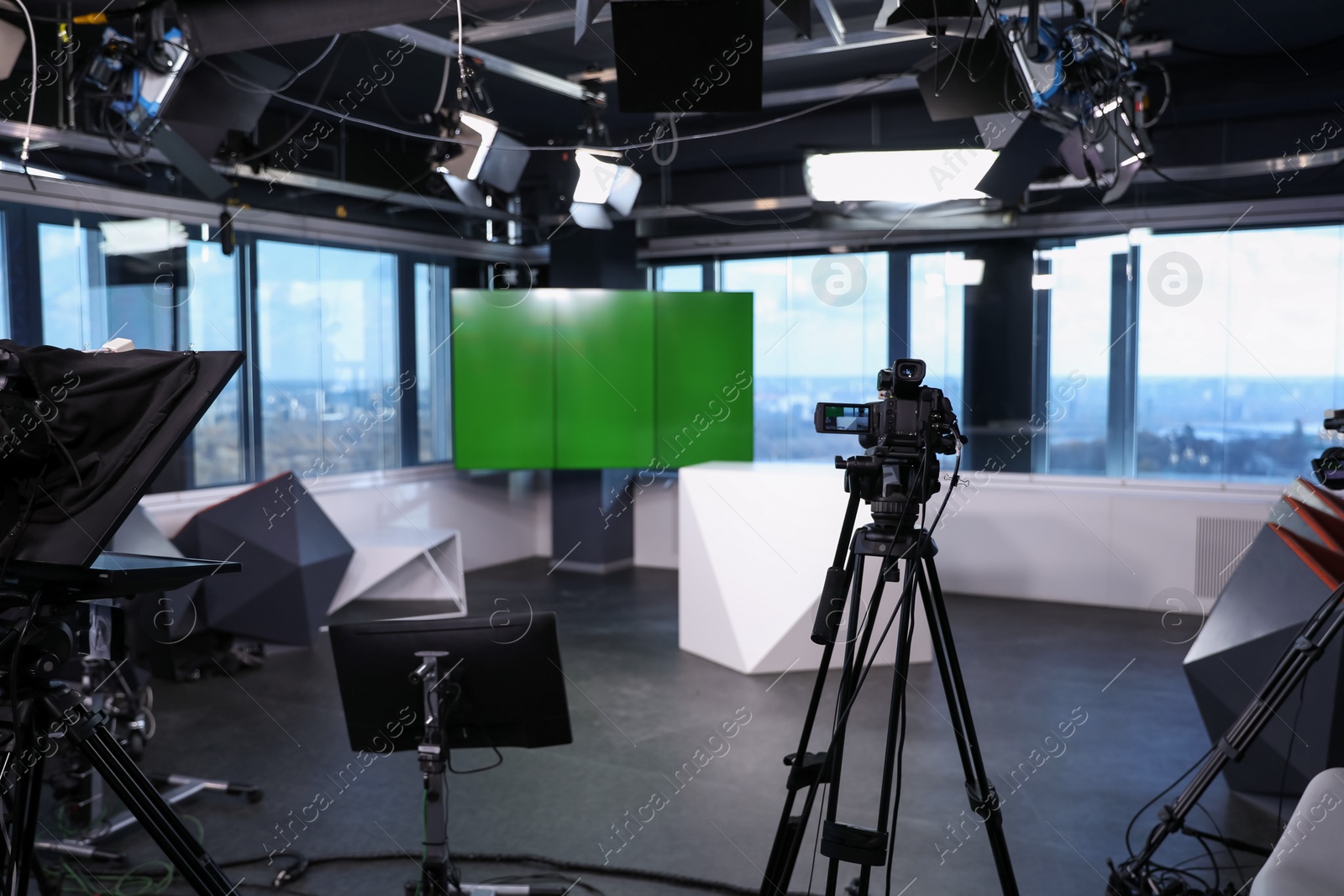 Photo of Modern video recording studio with professional cameras