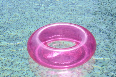 Photo of Inflatable ring floating on water in swimming pool