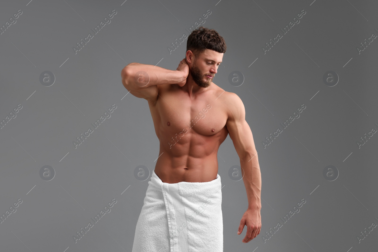 Photo of Handsome muscular man on grey background. Sexy body