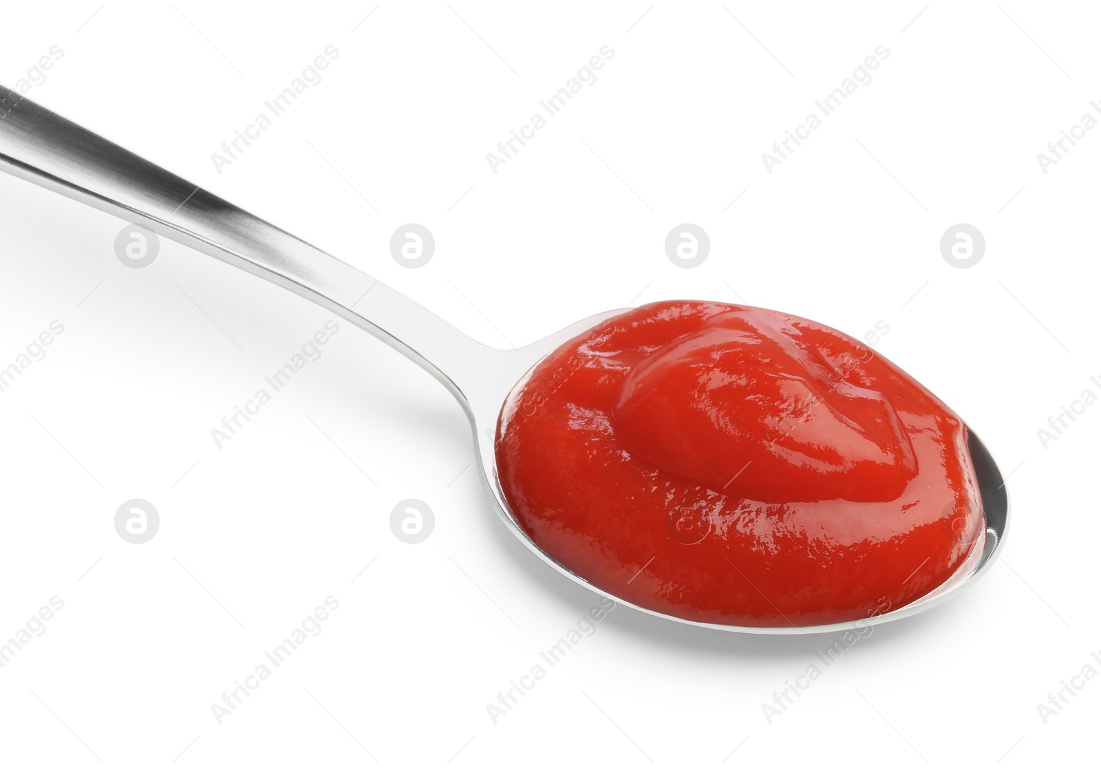 Photo of Tasty ketchup with spoon isolated on white. Tomato sauce