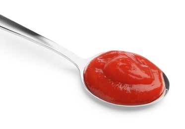 Photo of Tasty ketchup with spoon isolated on white. Tomato sauce