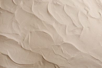 Photo of Dry beach sand as background, top view