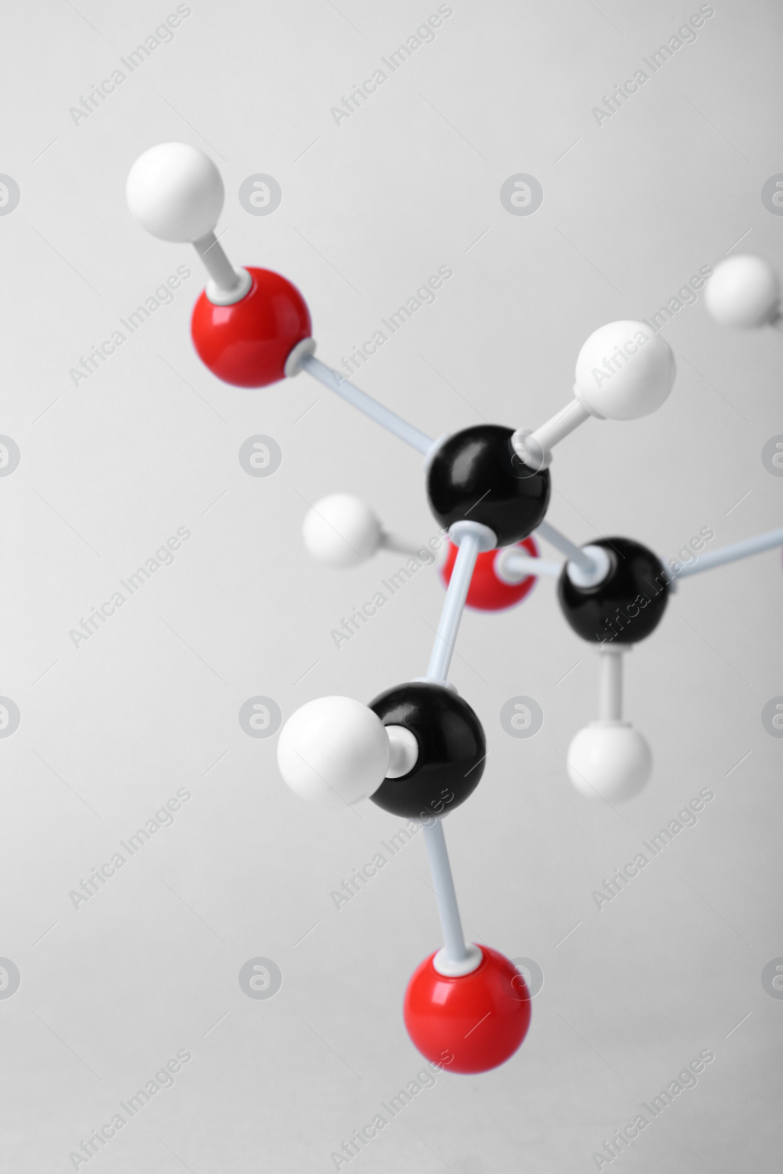 Photo of Molecule of glucose on light grey background, closeup. Chemical model