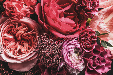 Photo of Beautiful bouquet of different flowers, closeup. Floral card design with dark vintage effect