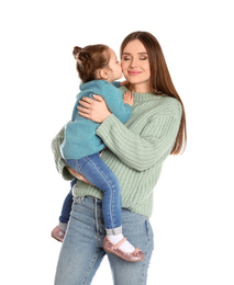 Young mother with little daughter on white background