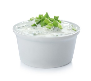 Photo of Bowl with cucumber sauce on white background