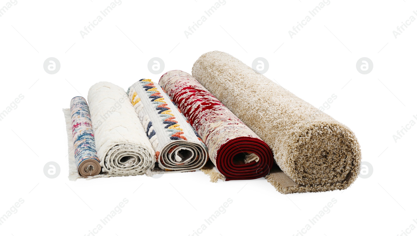 Photo of Rolled carpets on white background. Interior element