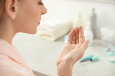 Photo of Young woman with eyelash loss problem indoors