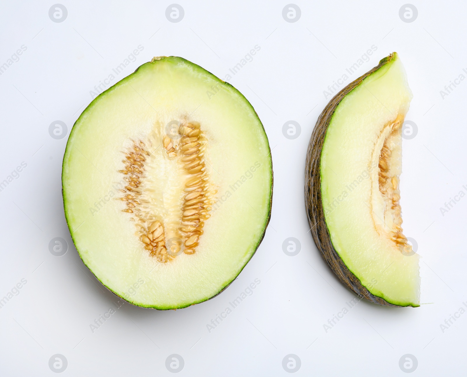 Photo of Ripe tasty melons on white background, top view