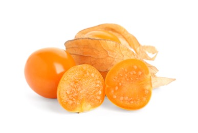 Photo of Cut and whole physalis fruits with dry husk on white background