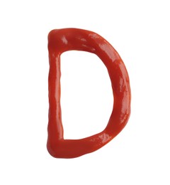 Photo of Letter D written with ketchup on white background