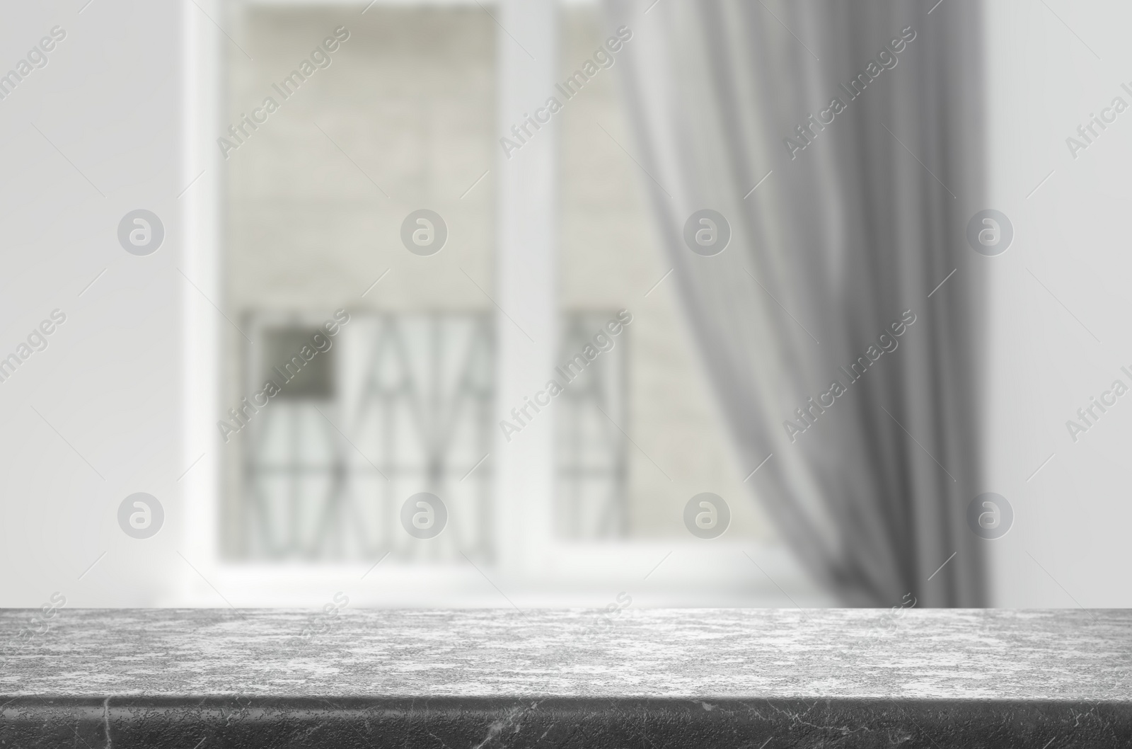 Image of Empty grey stone surface and blurred view of modern window  