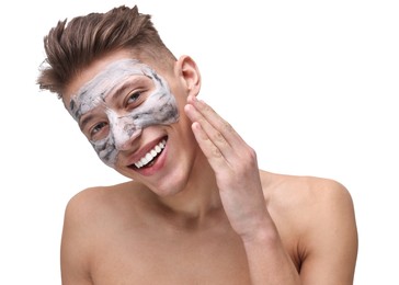 Photo of Handsome man with clay mask on his face against white background