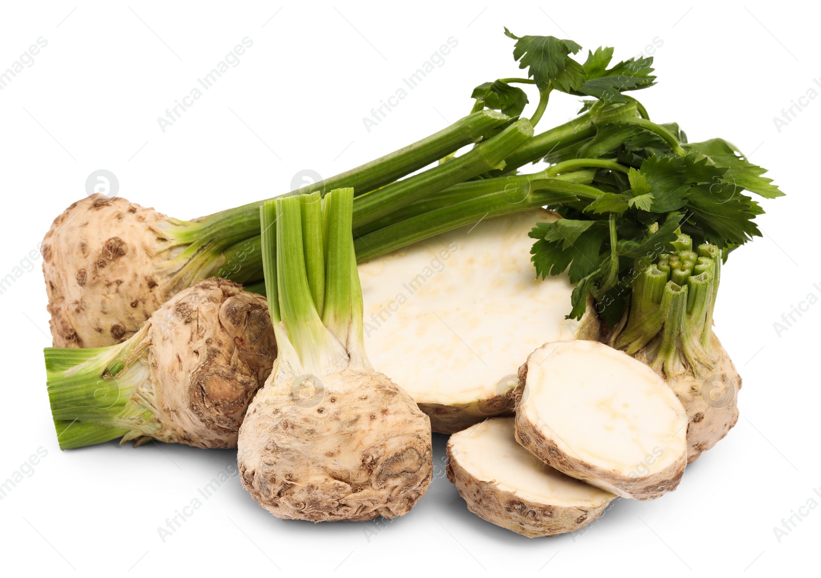 Photo of Whole and cut celery roots isolated on white