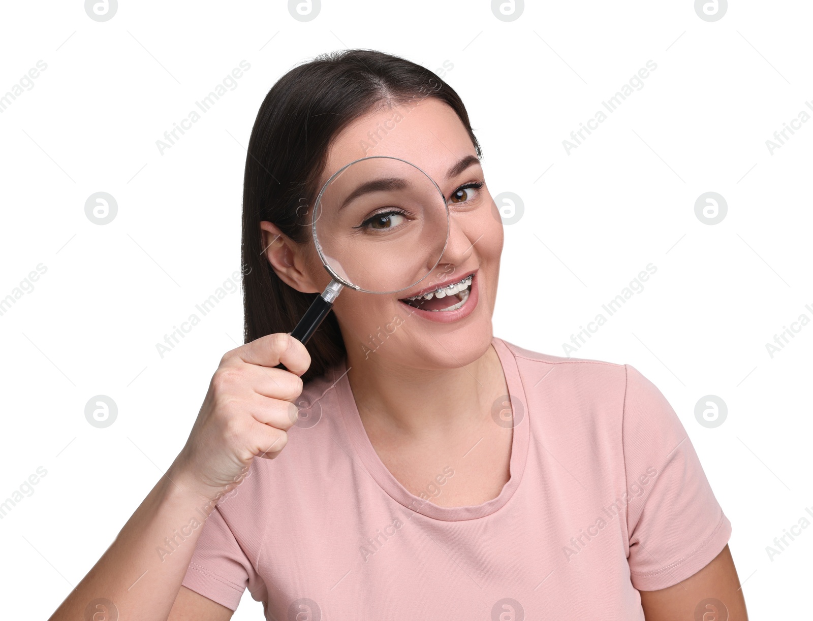 Photo of Beautiful woman looking through magnifier glass on white background