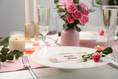 Photo of Romantic table setting with flowers and candles