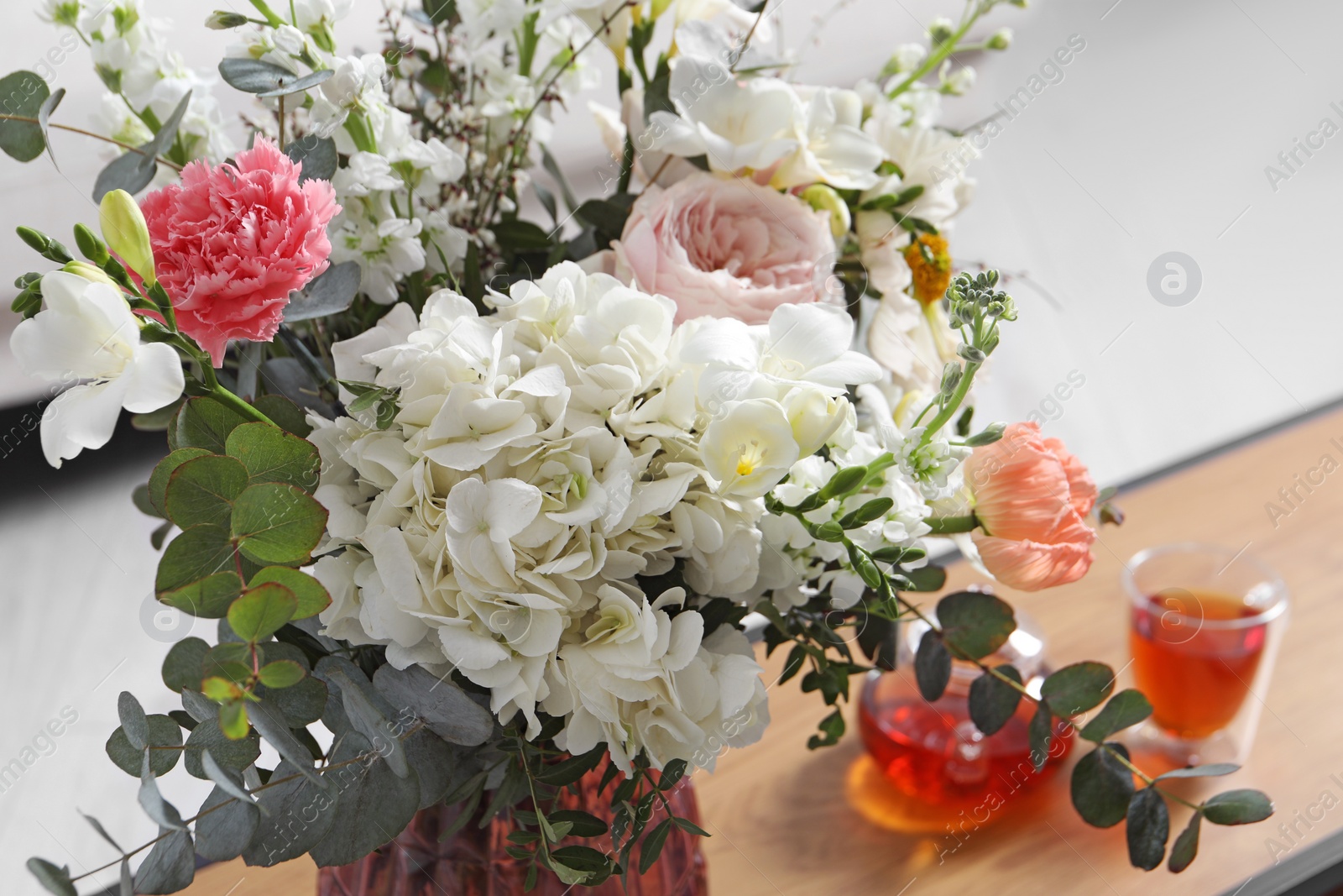 Photo of Bouquet of different beautiful flowers indoors, closeup