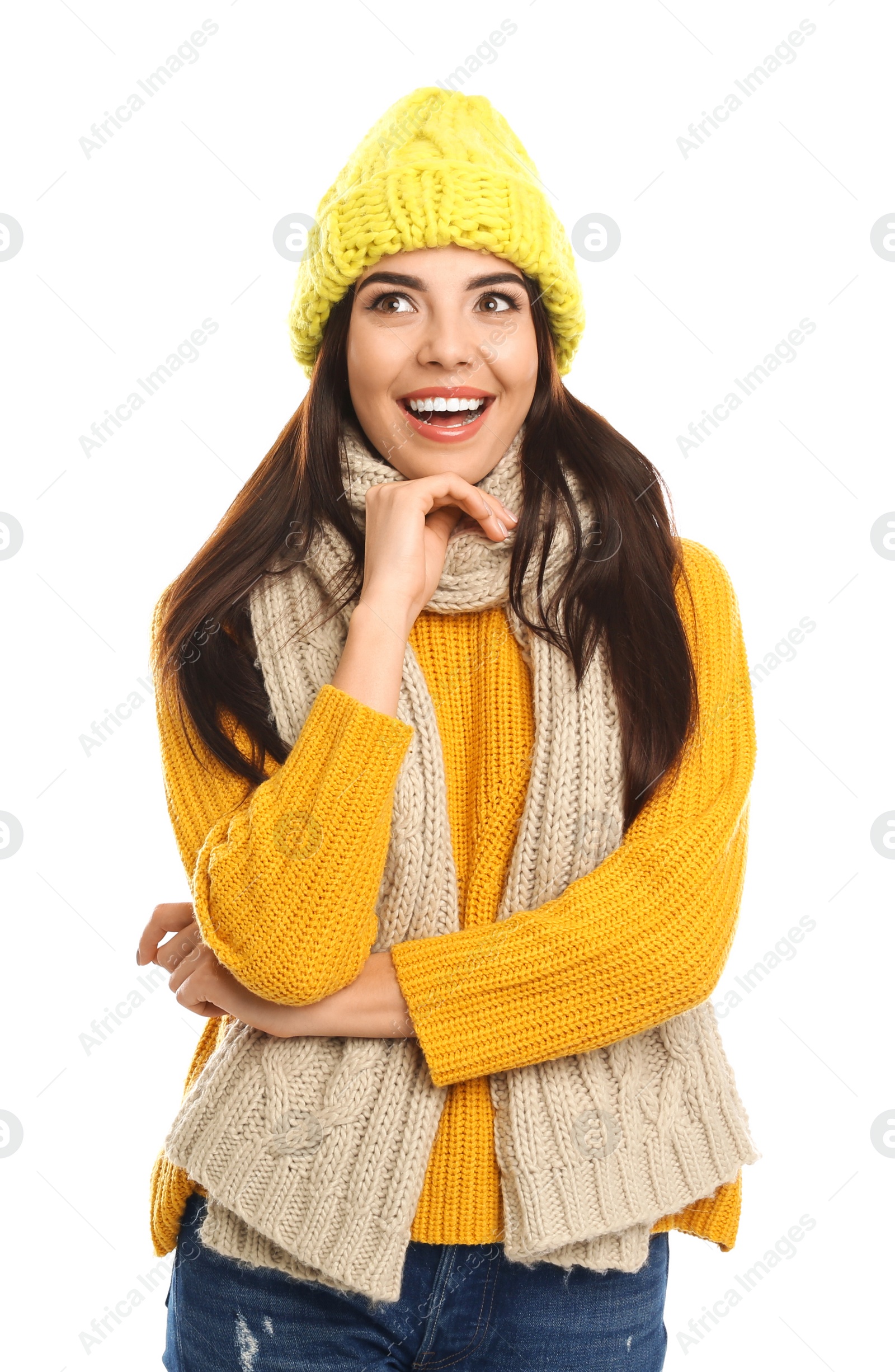 Photo of Happy young woman in warm clothes on white background. Winter vacation