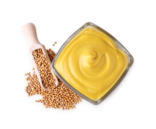 Photo of Bowl of delicious mustard and scoop with seeds on white background, top view