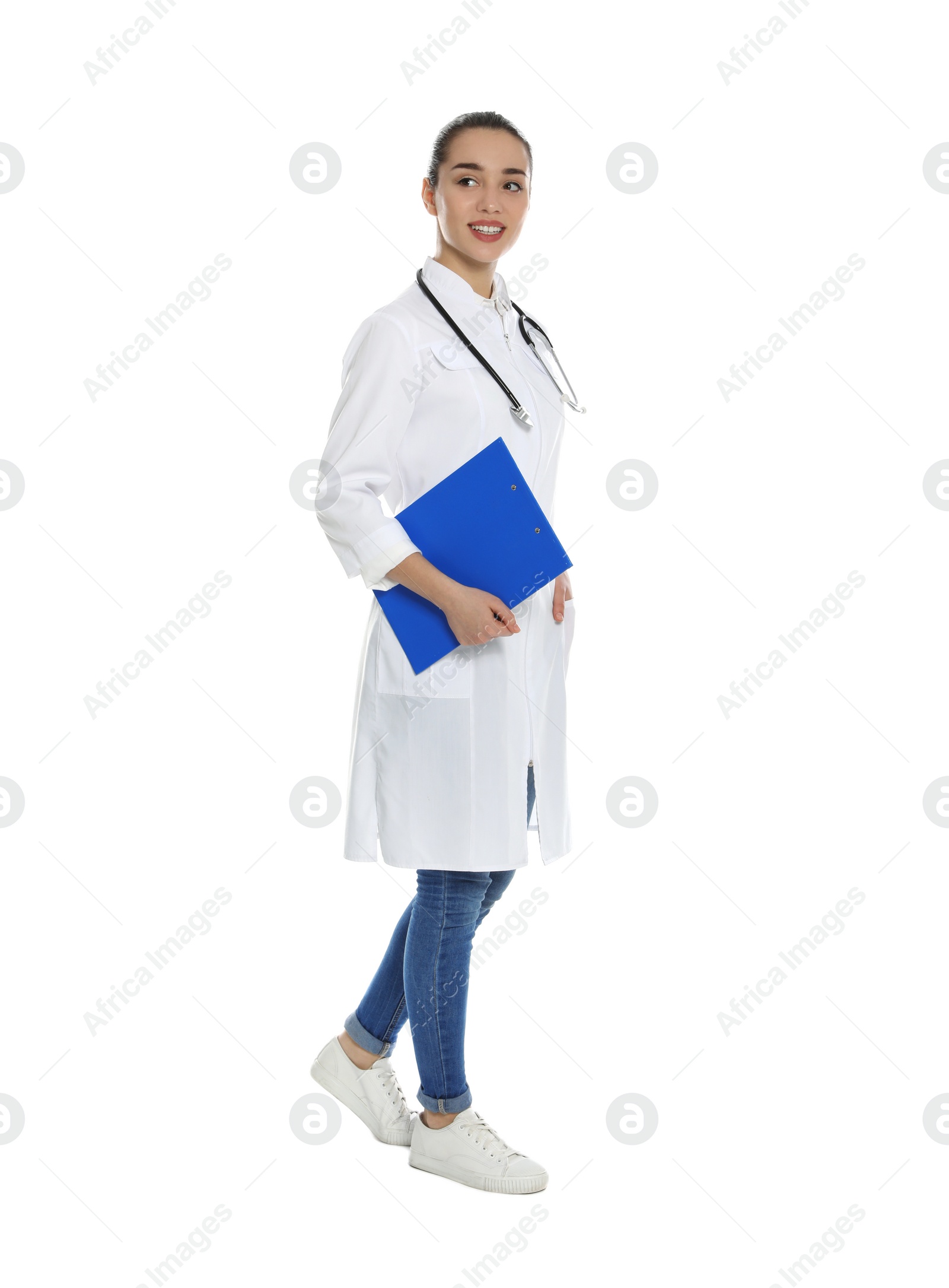 Photo of Full length portrait of medical doctor with clipboard and stethoscope isolated on white