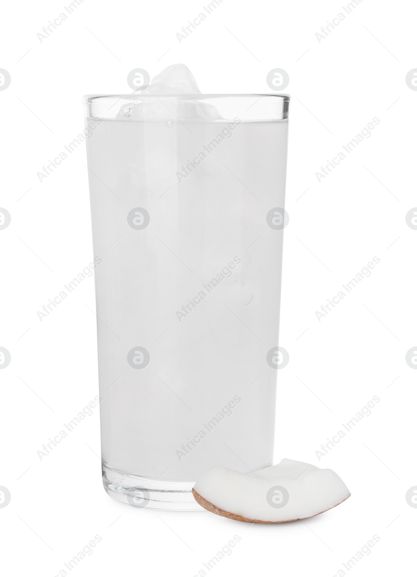 Photo of Glass of coconut water, ice cubes and nut isolated on white