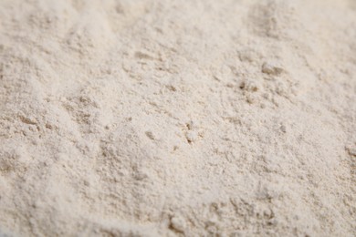 Photo of Pile of quinoa flour as background, closeup