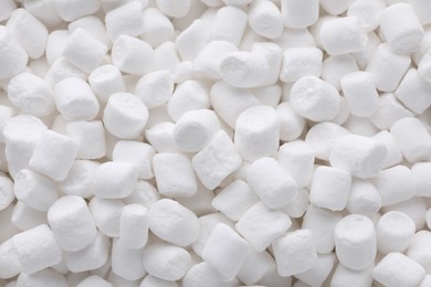 Photo of Many delicious sweet marshmallows as background, closeup