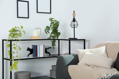 Photo of Console table with decor and couch in living room
