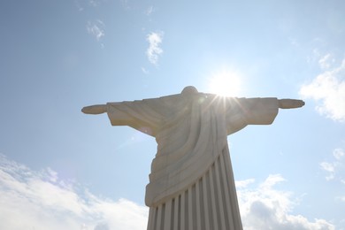 Truskavets, Ukraine - July 22, 2023: Beautiful statue of Christ the Redeemer against cloudy blue sky, low angle view