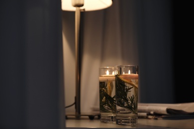 Photo of Natural homemade mosquito repellent candles on table in room
