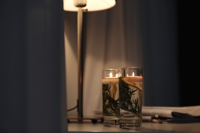 Natural homemade mosquito repellent candles on table in room