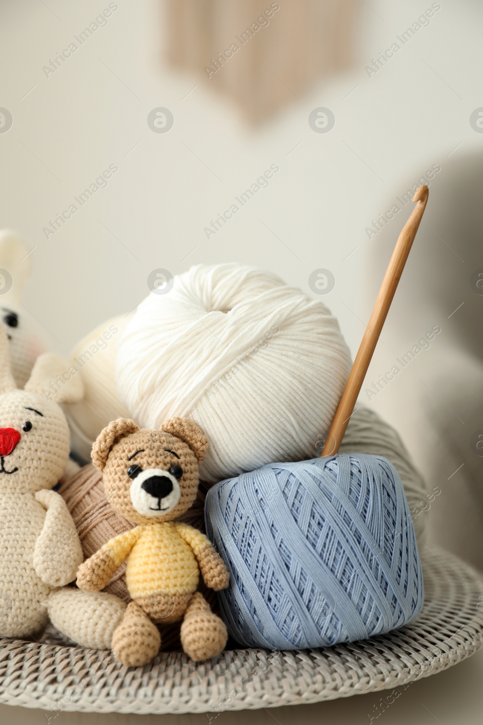 Photo of Toys, clews and crochet on table. Engaging in hobby