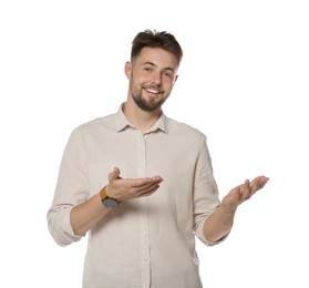 Photo of Handsome young man gesturing on white background