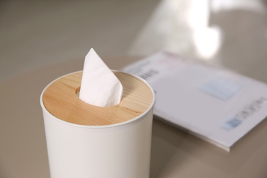 Photo of Box with paper tissues on light table, closeup