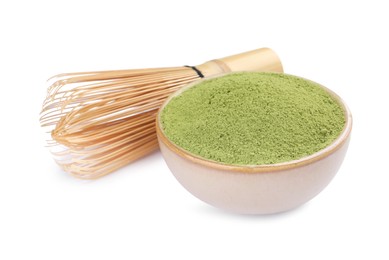 Photo of Bamboo whisk and bowl with matcha powder isolated on white