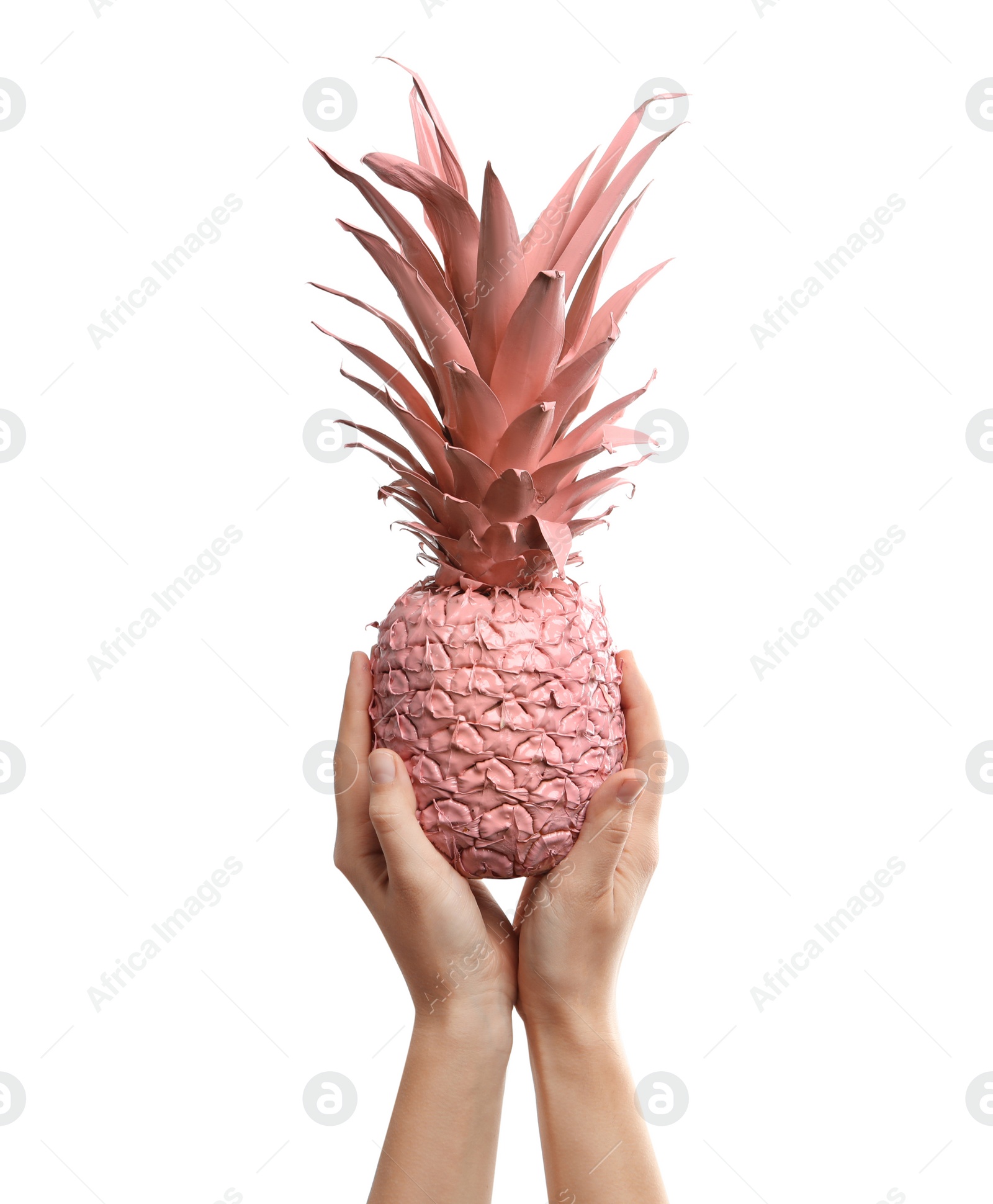 Photo of Woman holding coral painted pineapple on white background, closeup