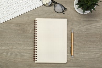 Photo of Flat lay composition with notebook on wooden table