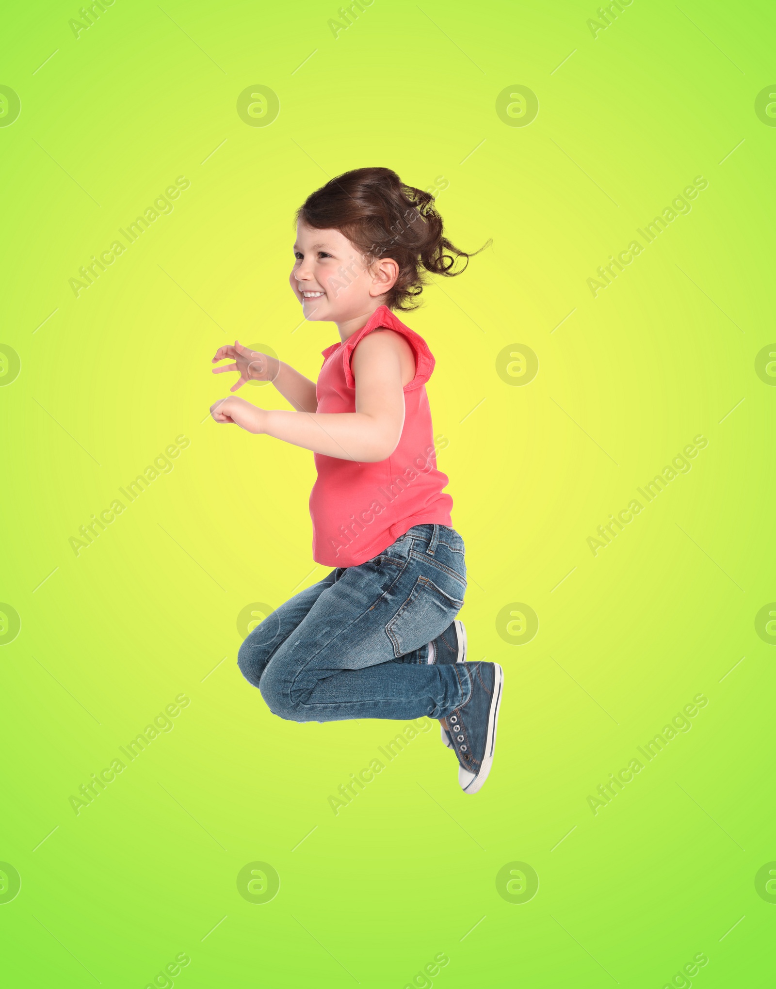 Image of Happy cute girl jumping on color gradient background