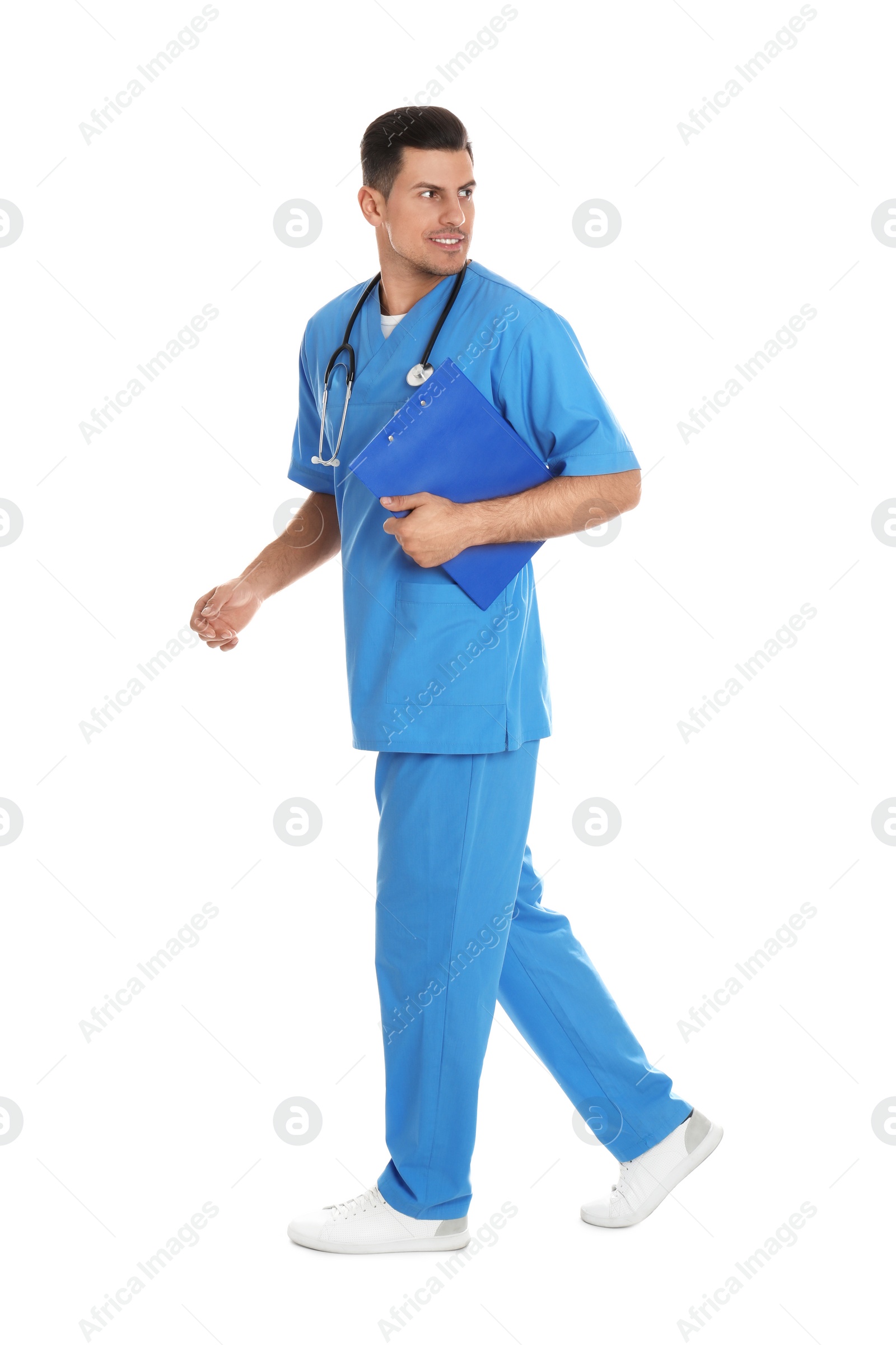 Photo of Doctor with clipboard walking on white background