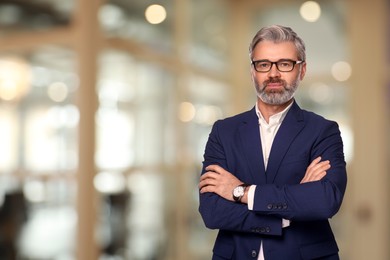 Image of Successful lawyer in glasses on blurred background, space for text
