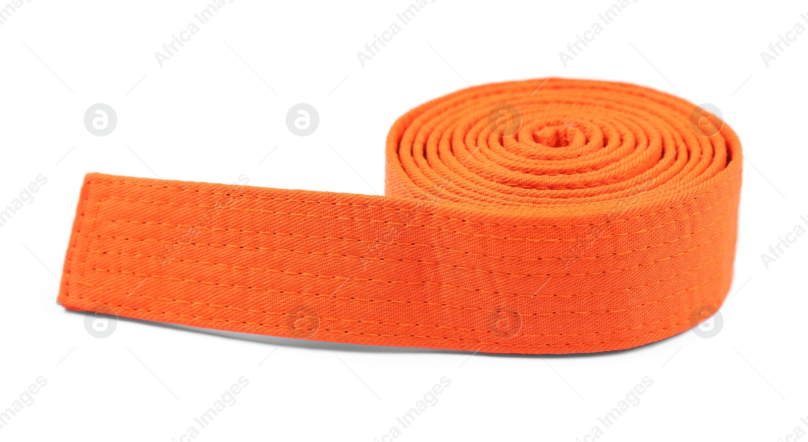 Photo of Orange karate belt isolated on white. Martial arts uniform