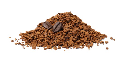 Photo of Heap of instant coffee and beans on white background