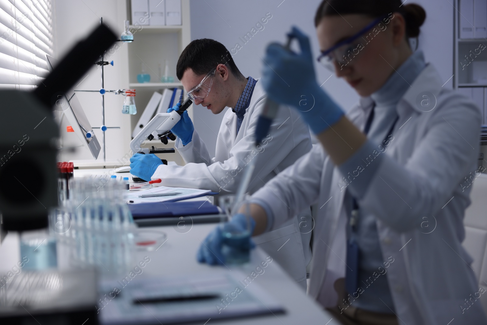 Photo of Scientists working with samples in laboratory. Medical research