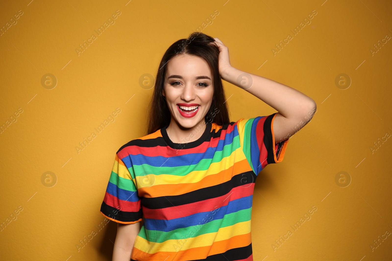 Photo of Portrait of beautiful young woman on colorful background